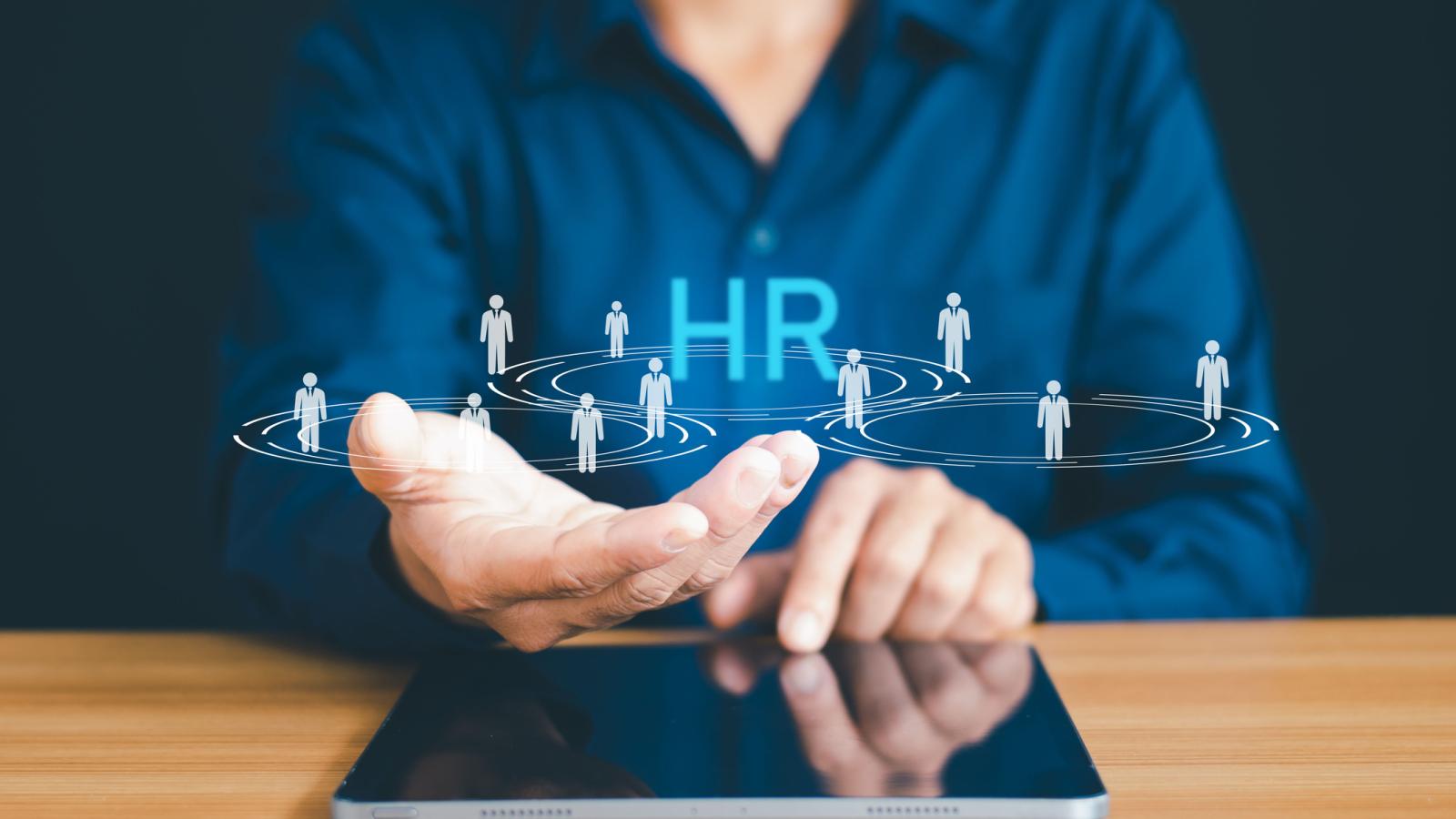 Person holding a HR infographic